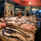 Vendors wait for customers in a fish market near the canal of Port Said